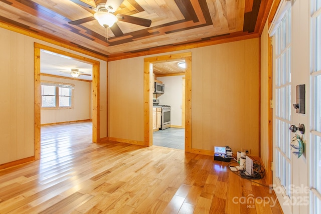 7150 Yellow Creek Rd, Robbinsville, NC 28771 - unfurnished room featuring ceiling fan, light wood-style floors, and wooden walls