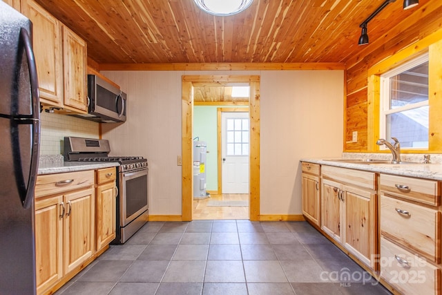7150 Yellow Creek Rd, Robbinsville, NC 28771 - kitchen with appliances with stainless steel finishes, electric water heater, wooden ceiling, a sink, and wood walls