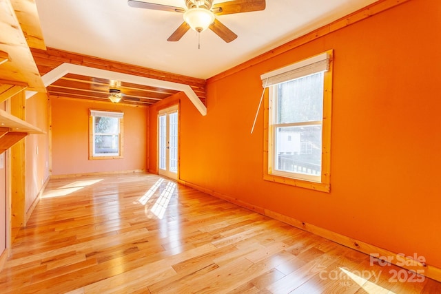 7150 Yellow Creek Rd, Robbinsville, NC 28771 - unfurnished room with healthy amount of natural light, ceiling fan, french doors, beamed ceiling, and wood finished floors