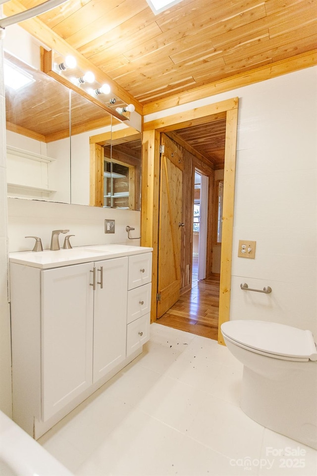 7150 Yellow Creek Rd, Robbinsville, NC 28771 - bathroom with wood ceiling, toilet, vanity, and wood walls