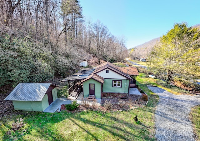 7150 Yellow Creek Rd, Robbinsville, NC 28771 - view of front of property featuring a front lawn and an outbuilding