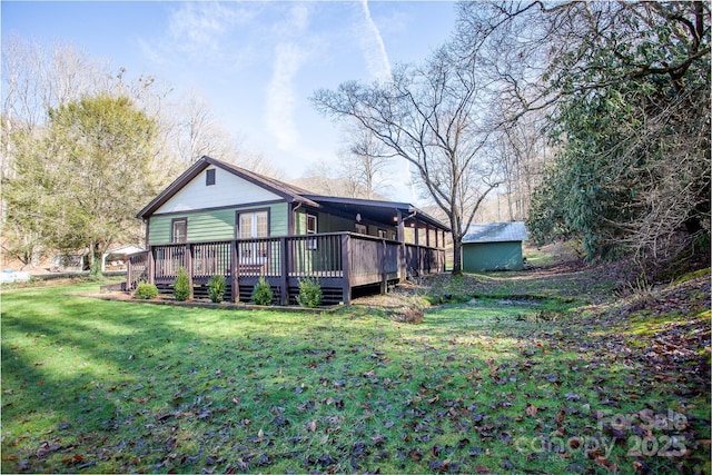 7150 Yellow Creek Rd, Robbinsville, NC 28771 - rear view of house featuring a lawn and a wooden deck