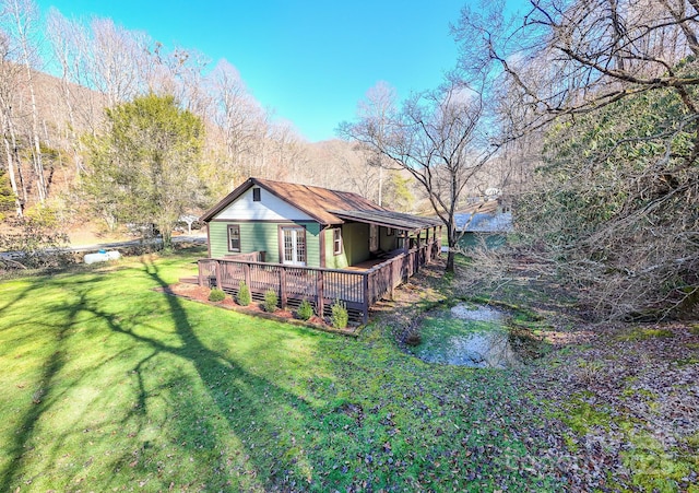 7150 Yellow Creek Rd, Robbinsville, NC 28771 - rear view of house with a wooden deck and a lawn