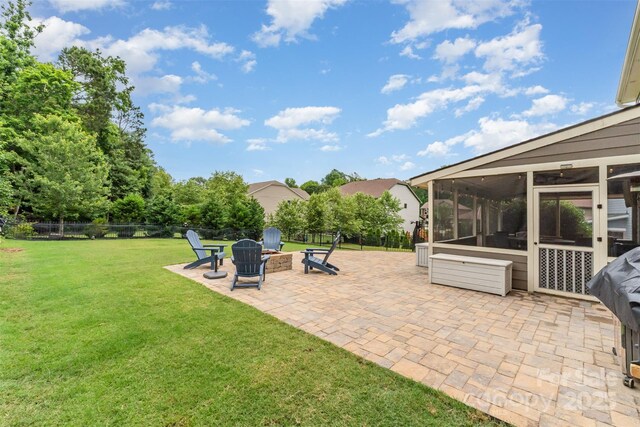 755 Lagan Ct, Fort Mill, SC 29715 - view of patio with a sunroom and an outdoor fire pit