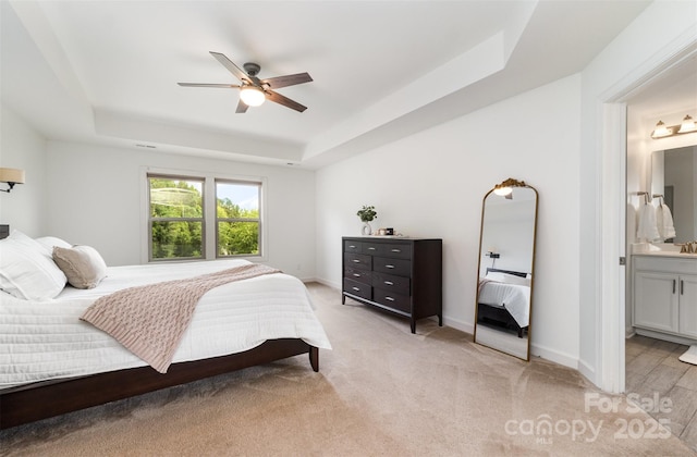 755 Lagan Ct, Fort Mill, SC 29715 - bedroom featuring a tray ceiling, baseboards, light carpet, and ensuite bath