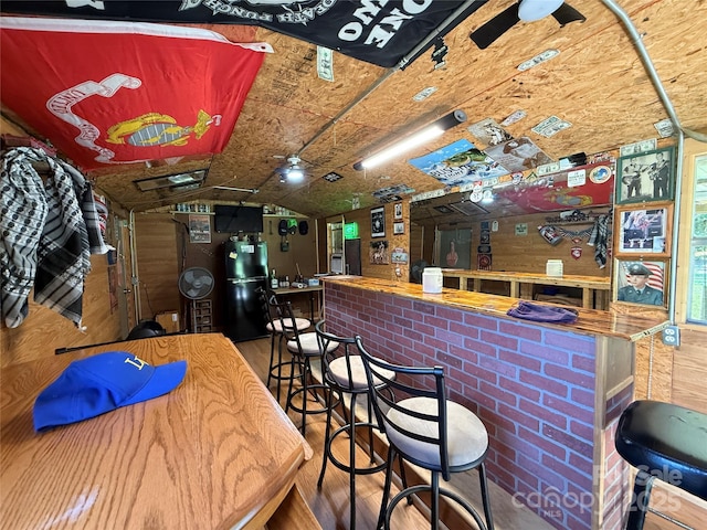 4285 Palmer Lloyd Rd, Lancaster, SC 29720 - indoor dry bar with freestanding refrigerator, wood finished floors, and vaulted ceiling