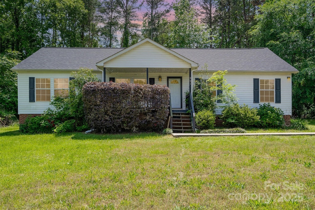 321 Woodcrest Dr, York, SC 29745 - single story home featuring a yard, a porch, stairway, and roof with shingles