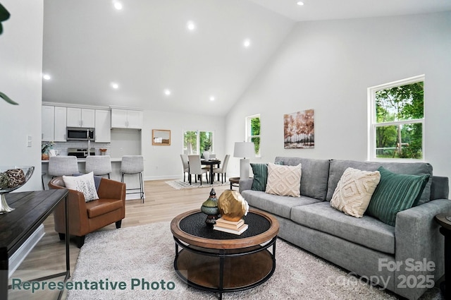2116A Glenwood St, Kannapolis, NC 28083 - living room with high vaulted ceiling, light wood-type flooring, recessed lighting, and baseboards