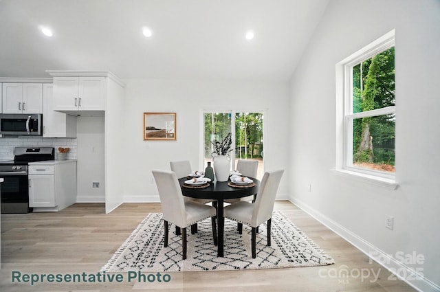 2116A Glenwood St, Kannapolis, NC 28083 - dining room with healthy amount of natural light, light wood-style floors, vaulted ceiling, baseboards, and recessed lighting