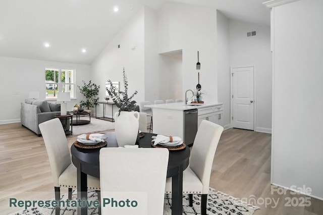 2116A Glenwood St, Kannapolis, NC 28083 - dining room featuring high vaulted ceiling, light wood-style floors, baseboards, and recessed lighting