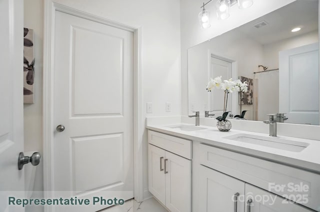 2116A Glenwood St, Kannapolis, NC 28083 - bathroom featuring double vanity and marble finish flooring