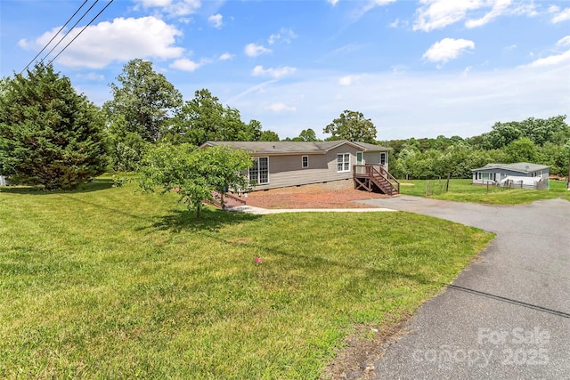 1730 Woodbend Ln, Conover, NC 28613 - view of front of home featuring crawl space, a front lawn, and asphalt driveway