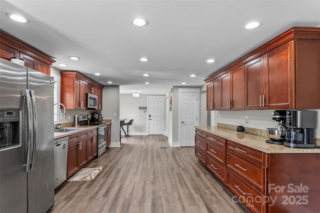 1730 Woodbend Ln, Conover, NC 28613 - kitchen with appliances with stainless steel finishes, a sink, recessed lighting, baseboards, and wood finished floors