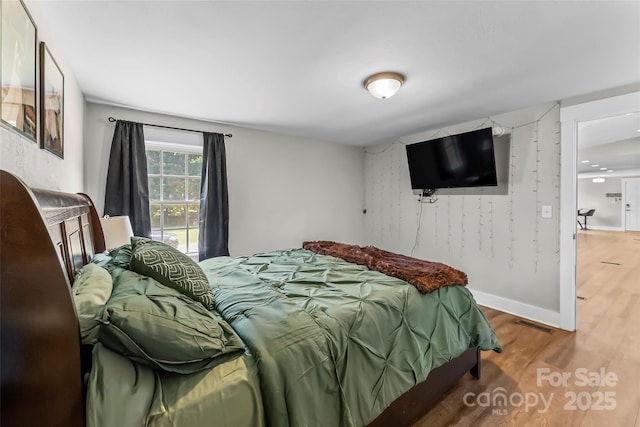 1730 Woodbend Ln, Conover, NC 28613 - bedroom with wood finished floors and baseboards