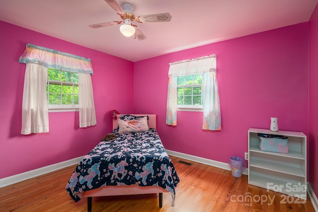 3120 7th Street Dr NE, Hickory, NC 28601 - bedroom with wood finished floors and a ceiling fan