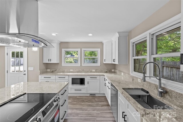 933 Old Charlotte Rd, Concord, NC 28027 - kitchen featuring electric stove, a sink, island exhaust hood, stainless steel dishwasher, and built in microwave