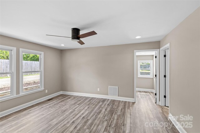 933 Old Charlotte Rd, Concord, NC 28027 - spare room featuring plenty of natural light, ceiling fan, light wood-style floors, recessed lighting, and baseboards