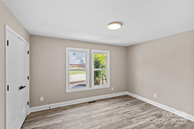 933 Old Charlotte Rd, Concord, NC 28027 - unfurnished room with wood finished floors and baseboards
