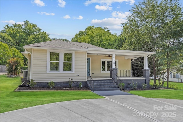 933 Old Charlotte Rd, Concord, NC 28027 - view of front facade featuring a porch, a ceiling fan, a front yard, and central AC