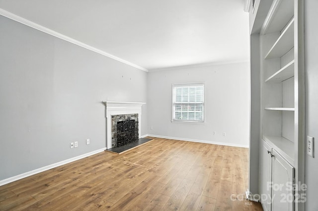 5947 Quail Hollow Rd Unit A, Charlotte, NC 28210 - unfurnished living room featuring crown molding, wood-type flooring, and a premium fireplace