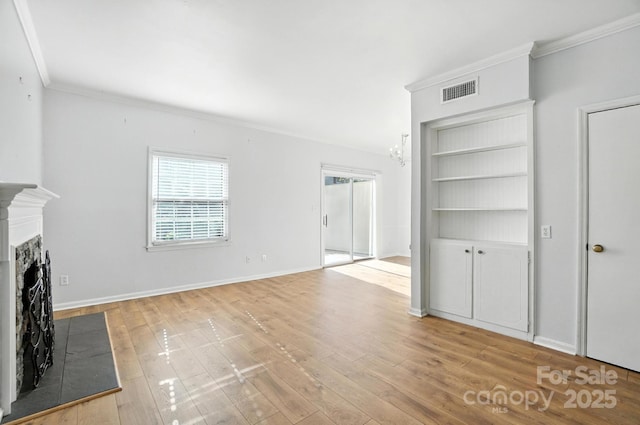 5947 Quail Hollow Rd Unit A, Charlotte, NC 28210 - unfurnished living room with ornamental molding, light wood finished floors, a fireplace, and a chandelier