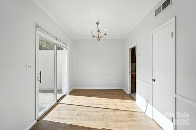 5947 Quail Hollow Rd Unit A, Charlotte, NC 28210 - empty room with a chandelier and wood finished floors
