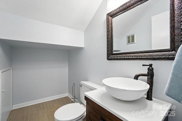 5947 Quail Hollow Rd Unit A, Charlotte, NC 28210 - half bathroom featuring vanity and lofted ceiling