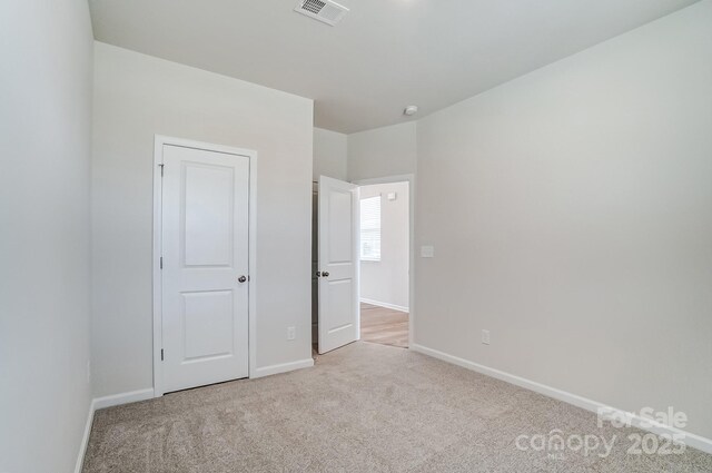 2648 Tillman St, Monroe, NC 28112 - unfurnished bedroom featuring carpet and baseboards