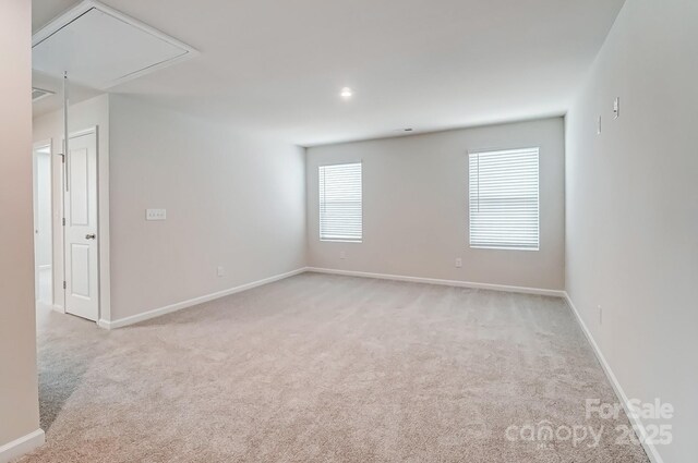 2648 Tillman St, Monroe, NC 28112 - spare room with attic access, carpet, and baseboards