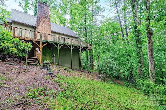 809 Westminster Cir SW, Lenoir, NC 28645 - back of property featuring a deck and a chimney