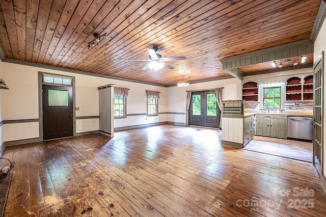 809 Westminster Cir SW, Lenoir, NC 28645 - unfurnished living room featuring wood ceiling, hardwood / wood-style flooring, ceiling fan, healthy amount of natural light, and baseboards