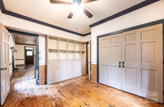 809 Westminster Cir SW, Lenoir, NC 28645 - unfurnished bedroom featuring crown molding, hardwood / wood-style flooring, a closet, and ceiling fan