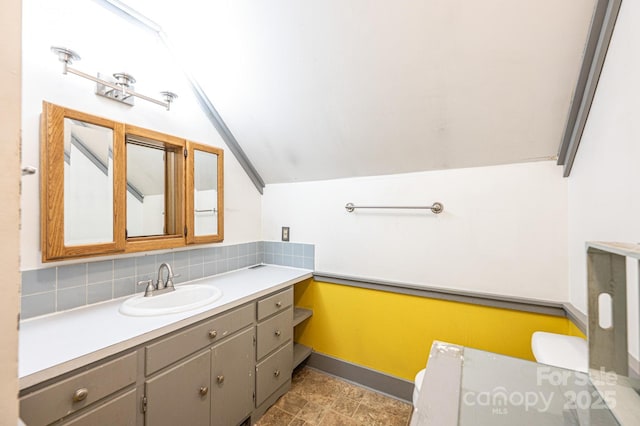 809 Westminster Cir SW, Lenoir, NC 28645 - bathroom with vanity, lofted ceiling, and tasteful backsplash