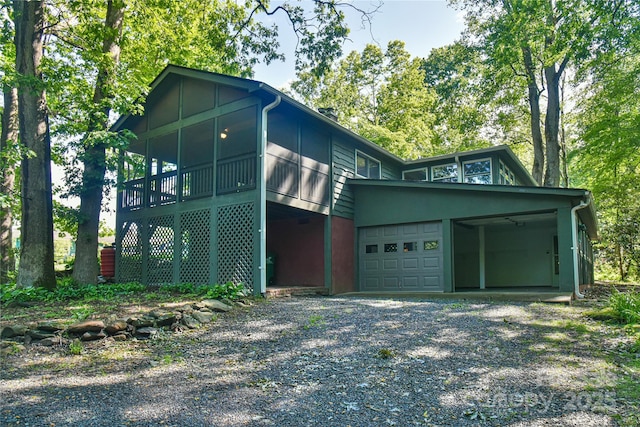 5 Old Cove Rd, Black Mountain, NC 28711 - view of side of home with a sunroom, driveway, a carport, and an attached garage