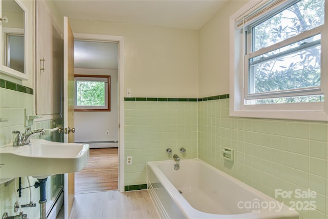 5 Old Cove Rd, Black Mountain, NC 28711 - full bath featuring tile walls, healthy amount of natural light, a garden tub, wood finished floors, and a wainscoted wall