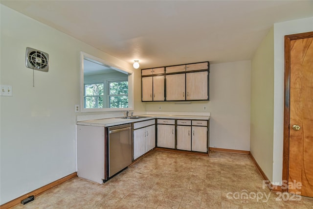 5 Old Cove Rd, Black Mountain, NC 28711 - kitchen with dishwasher, light countertops, baseboards, and a sink