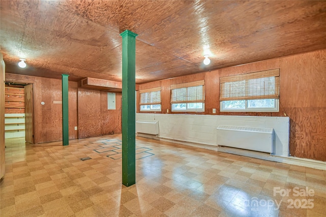 5 Old Cove Rd, Black Mountain, NC 28711 - below grade area with radiator, tile patterned floors, and wooden walls