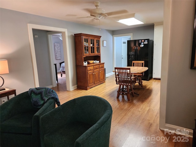 2904 E Brocktown Rd, Moravian Falls, NC 28654 - dining room featuring ceiling fan, light wood finished floors, and baseboards