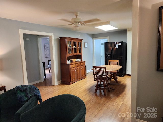 2904 E Brocktown Rd, Moravian Falls, NC 28654 - dining space featuring ceiling fan, light wood-style flooring, and baseboards