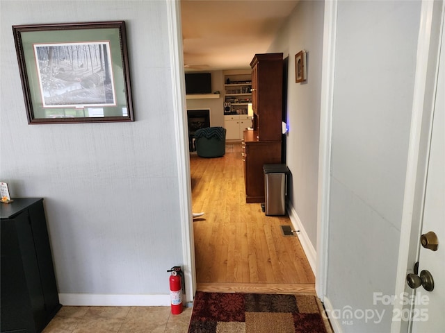 2904 E Brocktown Rd, Moravian Falls, NC 28654 - hall with baseboards and light wood-style flooring