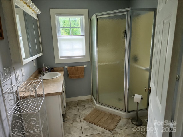 2904 E Brocktown Rd, Moravian Falls, NC 28654 - bathroom with vanity, a shower stall, and baseboards