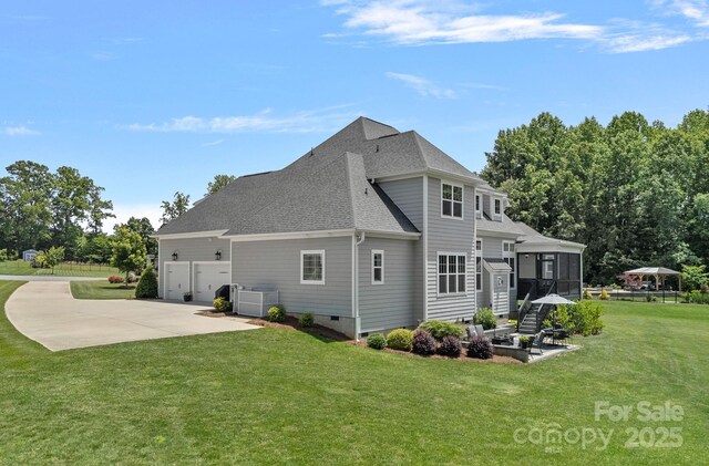 224 Hidden Meadows Dr, Mooresville, NC 28117 - view of home's exterior with a sunroom, crawl space, a lawn, roof with shingles, and central AC unit