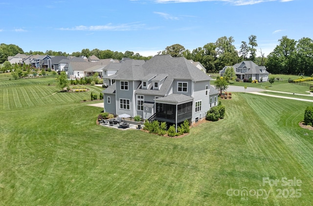 224 Hidden Meadows Dr, Mooresville, NC 28117 - rear view of house featuring a sunroom, a lawn, a residential view, a patio, and roof with shingles