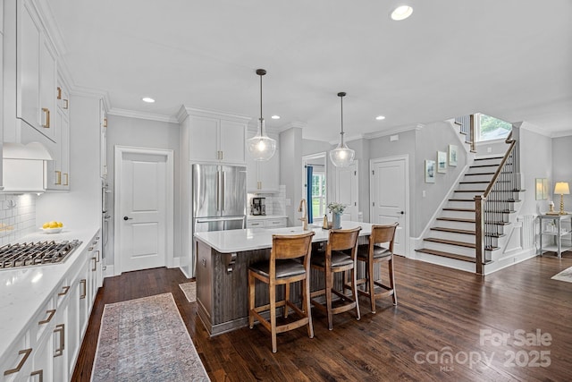 224 Hidden Meadows Dr, Mooresville, NC 28117 - kitchen featuring appliances with stainless steel finishes, backsplash, plenty of natural light, dark wood finished floors, and recessed lighting