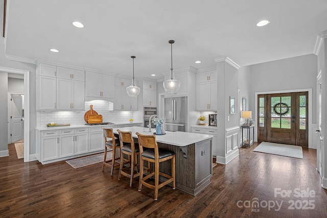 224 Hidden Meadows Dr, Mooresville, NC 28117 - kitchen featuring stainless steel appliances, light countertops, white cabinets, backsplash, and recessed lighting