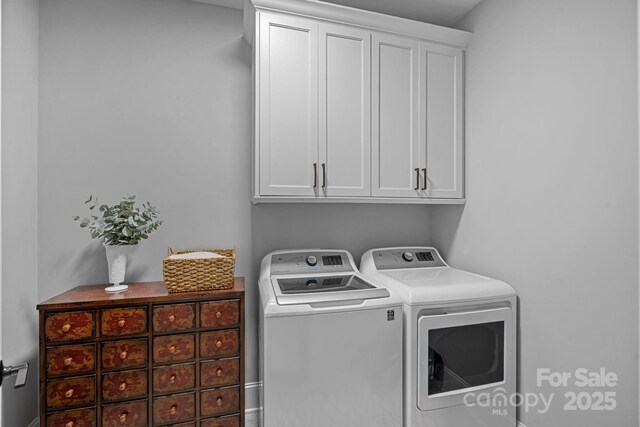 224 Hidden Meadows Dr, Mooresville, NC 28117 - laundry area with cabinet space and washer and clothes dryer