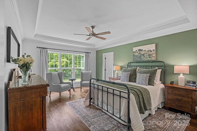 224 Hidden Meadows Dr, Mooresville, NC 28117 - bedroom with a raised ceiling, wood finished floors, ceiling fan, and ornamental molding