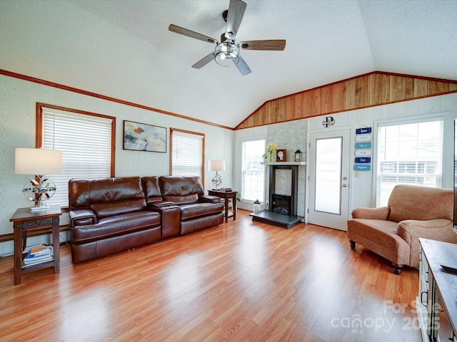 4115 Jenkins Rd, Marshville, NC 28103 - living room with vaulted ceiling, light wood-style floors, a ceiling fan, a textured ceiling, and a baseboard heating unit