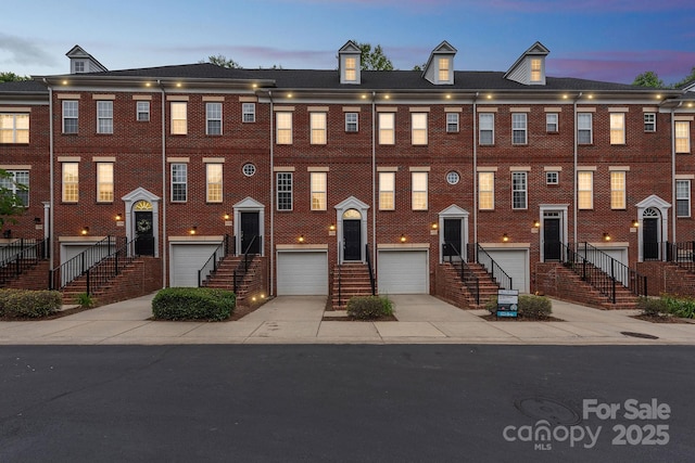 1126 Dean Hall Ln, Matthews, NC 28105 - townhome / multi-family property featuring driveway, entry steps, and an attached garage