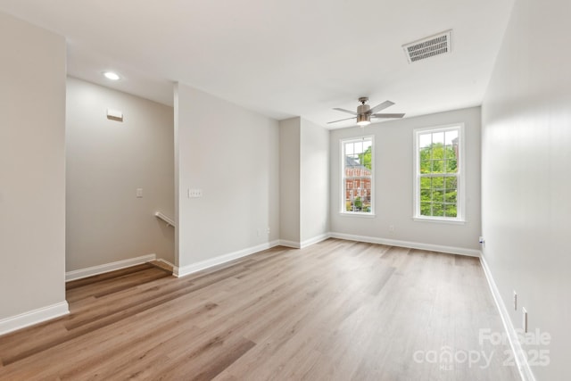 1126 Dean Hall Ln, Matthews, NC 28105 - spare room with light wood-style flooring, ceiling fan, recessed lighting, and baseboards